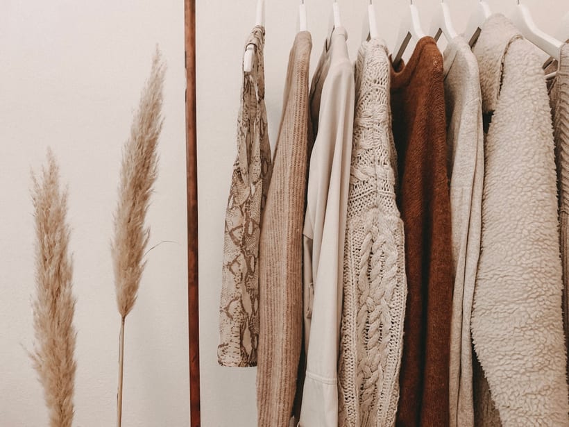 Clothes hanging on a wardrobe rail